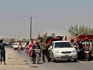 Afghan policemen search commuters at a checkpoint in Helmand province on August 9, 2016. (AFP/Noor Mohammed) Afghan policemen search commuters at a checkpoint in Helmand province on August 9, 2016. (AFP/Noor Mohammed)