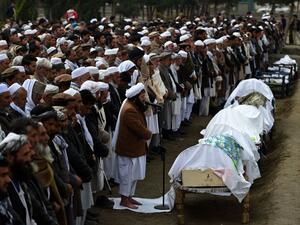 A funeral for a dozen Afghan migrants who had drowned in the Aegean Sea. (AFP/Wakil Kohsar)