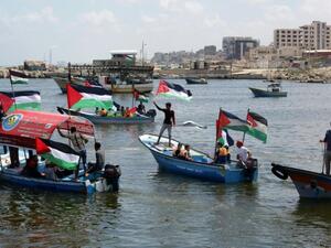 Palestinians in Gaza rally on boats in support of a freedom flotilla. (AFP/File)