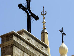 Church steeples stand amongst mosque minarets in religiously diverse Beirut, Lebanon.  (AFP/Joseph Eid)