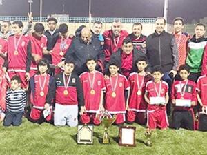 Al-Ahli Academy players with officials (Photo: Arab Times)
