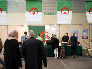 Algerians vote at a polling station in France on April 12, 2014.  (AFP/Bertrand Langlois)
