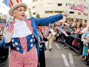 An American Christian pilgrim takes part in a Jerusalem parade celebrating the Jewish holiday Sukkot.  (AFP/File)