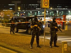 Dutch policemen stand guard by a cordoned off area outside Amsterdam's Schiphol Airport late on April 12, 2016, after it was partially evacuated following a security alert, and a person was one arrested, according to official sources. (AFP/Michel van Bergen) Dutch policemen stand guard by a cordoned off area outside Amsterdam's Schiphol Airport late on April 12, 2016, after it was partially evacuated following a security alert, and a person was one arrested, according to official sources. (AFP/Michel van Bergen)