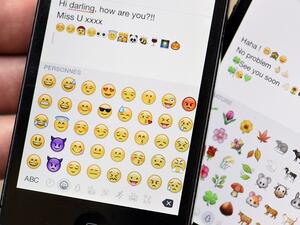 Apple reveals our most-used emoji, and it's the "tears of joy". (Miguel Medina/ AFP)