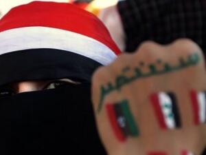 A young Yemeni woman's hand bears the flags of countries that took part in the Arab uprisings beginning in 2011.  (AFP/Marwan Naamani)