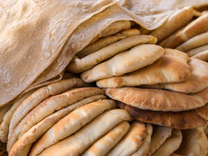 Those who arrive at the bakery early sometimes buy extra bread to feed to their livestock.