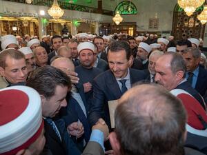 حضر المناسبة مجموعة من كبار المسؤولين في نظام الأسد، إضافة إلى المفتي أحمد بدر الدين حسون