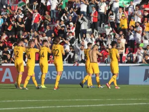 Australia's players celebrate after winning the 2019 AFC Asian Cup group B football match between Palestine and Australia at the Maktoum Bin Rashid Al-Maktoum Stadium in Dubai on January 11, 2019.
Karim Sahib / AFP