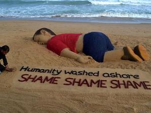 Indian artist Sudarsan Pattnaik works on a sand sculpture depicting drowned Syrian boy Aylan Kurdi. (AFP/File) Indian artist Sudarsan Pattnaik works on a sand sculpture depicting drowned Syrian boy Aylan Kurdi. (AFP/File)