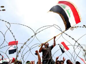 Supporters of Iraqi Shi'i cleric Muqtada al-Sadr storm demonstrate for government reform in late April 2016 outside Baghdad's 'Green Zone,' a tightly secured area of the capital city containing Parliament.  (AFP/File)