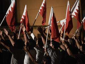 Protesters wave Bahraini flags. (AFP/File)