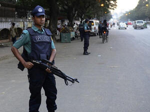 A police officer in Bangladesh watches over a busy street. (AFP/File) A police officer in Bangladesh watches over a busy street. (AFP/File)