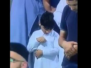 A viral video of a young boy seemingly checking on his pocket full of money is making the Internet coo in unison. (Screenshot/Facebook)