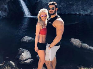 The 'Piece of Me' singer posted a picture of herself and the 23-year-old actor and fitness model enjoying a hike together to a romantic waterfall (Source: @britneyspears - Instagram)