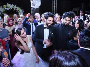 The happy couple on their wedding day. (Youm 7)