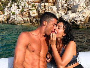 The loved-up couple were first seen strolling along the beach together (Source: georginagio / Instagram )