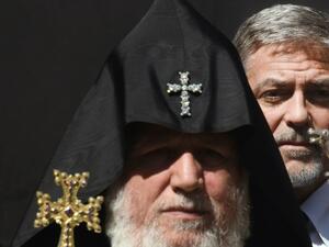 George Clooney next to a pope at the Genocide Memorial in Yerevan on April 24. (AFP / Karen Minasyan)