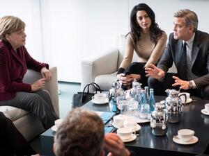 The Clooneys meet with Angela Merkel. (Guido Bergmann, BPA , EPA)