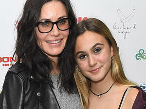 Courtney cut a stylish figure in a lightweight grey knit (Source: James Gourley / Shutterstock )