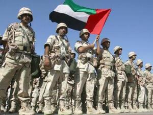 A contingent force from the UAE stand at ease on the tarmac of Kuwait International Airport on Feb. 23, 2003. (AFP/File)