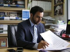 Human Rights Watch's Israel and Palestine director Omar Shakir, a US citizen, sits at his office in the West Bank city of Ramallah on May 9, 2018. (AFP / ABBAS MOMANI)
