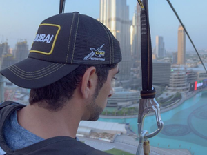 The video of Shaikh Hamdan riding a zip-line suspended above Downtown Dubai, with Burj Khalifa in the background, was posted on his Instagram page on Saturday evening. (Instagram)