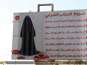A Daesh bilboard in Sirte, Libya, describing how women must be dressed. (AFP/File) A Daesh bilboard in Sirte, Libya, describing how women must be dressed. (AFP/File)