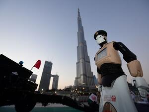 The world's first operational police robot stands at attention in Downtown Dubai on May 31, 2017. (AFP)