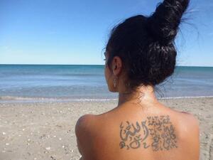 Dunia angered many of her fans by posting a picture of this anti-God tattoo. (Al Watan Voice)