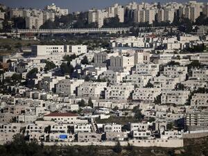 A general view taken on May 8, 2015, shows the east Jerusalem Israeli settlement of Ramat Shlomo (foreground) and part of Jerusalem city (background). (AFP/Thomas Coex)