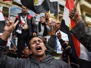 Egyptians holding national flags gather on Cairo's landmark Tahrir Square on January 25, 2016, as the country marks the fifth anniversary of the 2011 uprising. (AFP/File) Egyptians holding national flags gather on Cairo's landmark Tahrir Square on January 25, 2016, as the country marks the fifth anniversary of the 2011 uprising. (AFP/File)