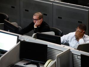 Traders working at the Egyptian stock exchange in Cairo. (AFP)