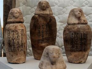 A picture taken on July 14, 2018 shows statuettes on display in front of the step pyramid of Saqqara, south of the Egyptian capital, Cairo (AFP/File Photo)	