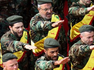 Hezbollah fighters salute during funeral for comrades. (AFP/File Photo)