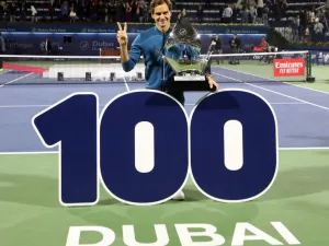 Switzerland's Roger Federer celebrates with the trophy after winning the final match at the ATP Dubai Tennis Championship in the Gulf emirate of Dubai on March 2, 2019. Roger Federer won his 100th career title when he defeated Greece's Stefanos Tsitsipas 6-4, 6-4 in the final of the Dubai Championships.
KARIM SAHIB / AFP