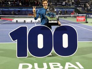Switzerland's Roger Federer celebrates with the trophy after winning the final match at the ATP Dubai Tennis Championship in the Gulf emirate of Dubai on March 2, 2019. Roger Federer won his 100th career title when he defeated Greece's Stefanos Tsitsipas 6-4, 6-4 in the final of the Dubai Championships.
KARIM SAHIB / AFP