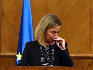 EU foreign policy chief Federica Mogherini reacts during a joint press conference with the Jordanian Foreign Minister in Amman, on March 22, 2016, upon receiving the news about a string of explosions that rocked Brussels airport and a city metro station. (AFP/Stringer)