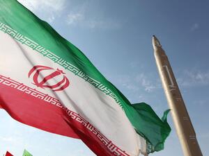 An Iranian flag flies near a surface-to-surface missile in an undisclosed location. (AFP/Getty/Vahid Reza Alaei)