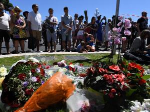 People stand on July 15, 2016 in front of a display in memory of those killed in Nice where a gunman smashed a truck into a crowd of revelers celebrating Bastille Day. (AFP/Boris Horvat) People stand on July 15, 2016 in front of a display in memory of those killed in Nice where a gunman smashed a truck into a crowd of revelers celebrating Bastille Day. (AFP/Boris Horvat)