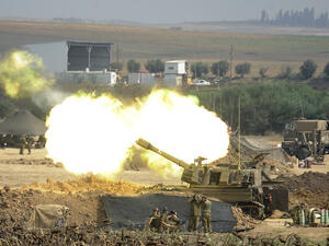 Israel Defense Forces on 29 July 2014 firing at one of the 70 Gaza targets struck overnight (David Buimovitch, AFP).