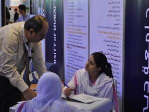 Dr. Amjad Al-Nasser, a professor in business, speak to prospective students
