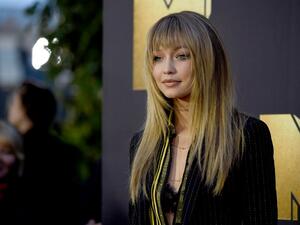 The 20-year-old says she wishes she could be on set with Zayn every day and that he is a natural model. (AFP/Frazer Harrison)
