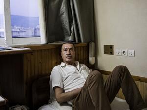 Moufid in his hotel room in Athens. (AFP)