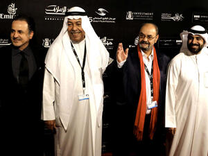 Kuwaiti Producer and film maker Walid al-Awadi (L), actors Saad al-Faraj (2nd L) and Khaled Ameen (R) pose during the photocall of "Tora Bora" movie in the opening ceremony of the Gulf Film Festival in Dubai on April 10, 2012. (AFP)
