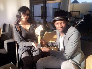 Ibtissam smiles as she receives her award. (Facebook)