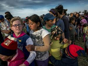 Children queue for food at the makeshift camp for migrants and refugees at the Greek-Macedonian border near the village of Idomeni on April 27, 2016. (AFP/Joe Klamar) Children queue for food at the makeshift camp for migrants and refugees at the Greek-Macedonian border near the village of Idomeni on April 27, 2016. (AFP/Joe Klamar)