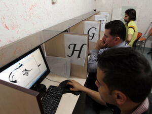 Iranians use an internet cafe in the capital Tehran.  (AFP/Atta Kenare)
