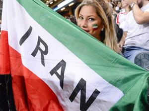 An Iranian supporter holds a flag during the friendly international football match between Sweden and Iran at the Friends Arena in Solna near Stockholm on March 31, 2015. (AFP/Jonathan Nackstrand) 