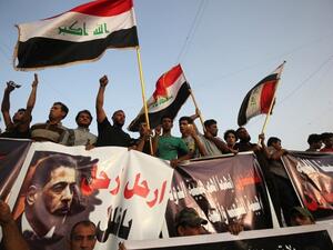 أنصار الصدر يهاجمون وزير الداخلية بعد التفجير الذي أودى بحياة 80 شخصا في مدينة الصدر - أ ف ب